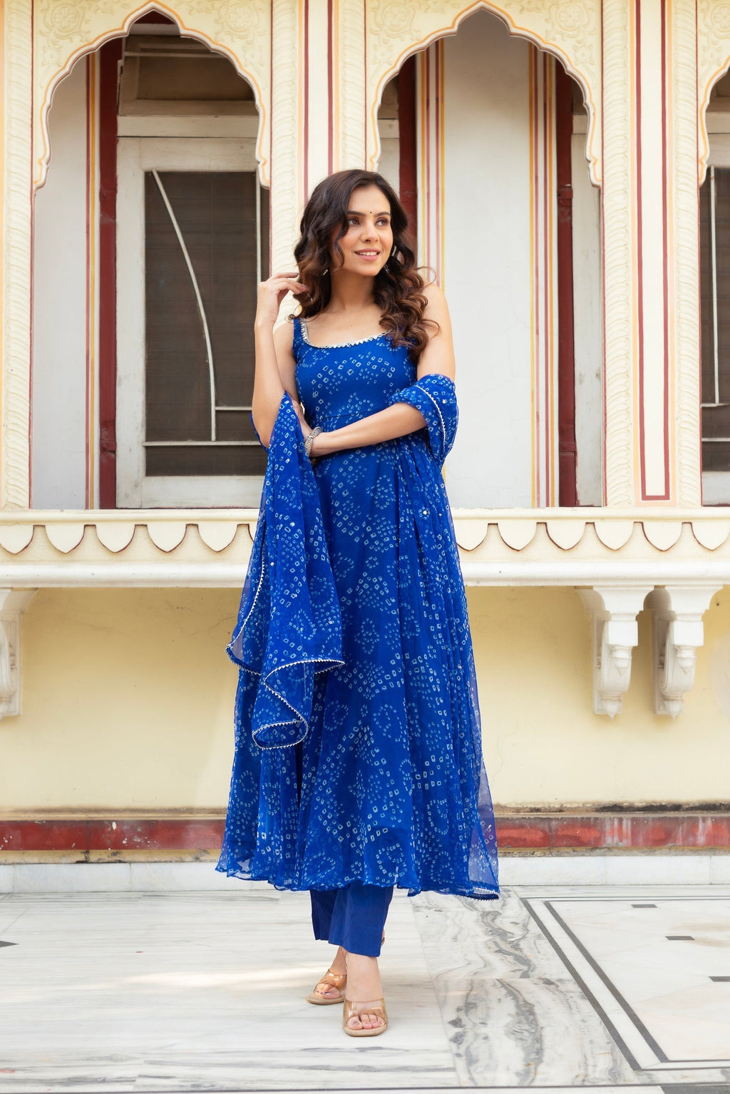 Adorning Blue Color Heavy Badhani Work Gown