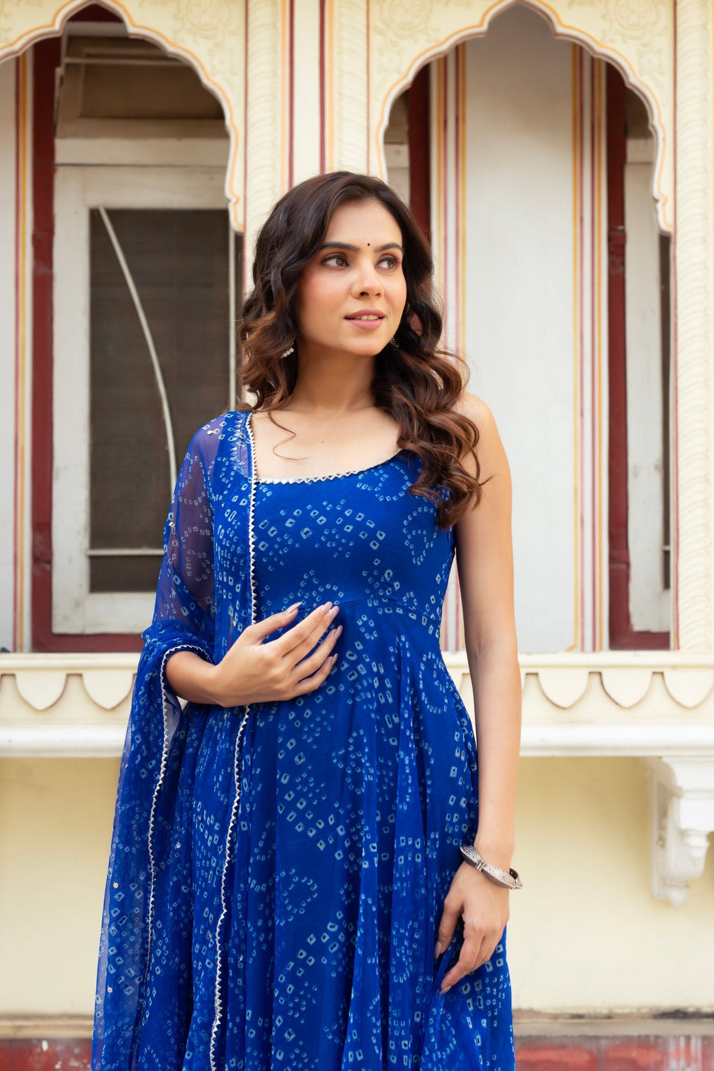 Adorning Blue Color Heavy Badhani Work Gown