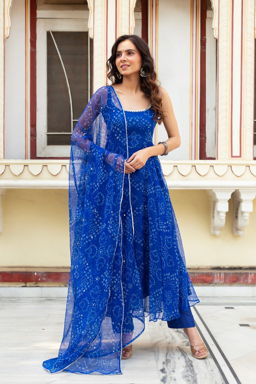 Adorning Blue Color Heavy Badhani Work Gown